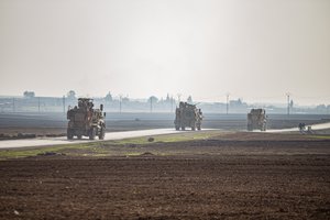 US military vehicles on a patrol in the countryside near the town of Qamishli, Syria, Sunday, Dec. 4, 2022