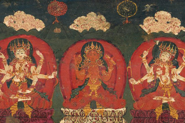 Painting of multi-armed goddesses sitting cross-legged in a mountainous painted landscape.