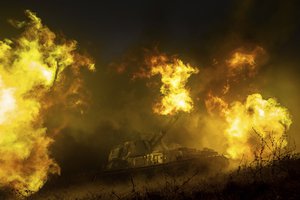 A Ukrainian self-propelled artillery shoots towards Russian forces at a frontline in Kharkiv region, Ukraine, Saturday, Dec. 24, 2022.