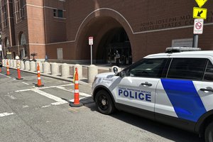 A federal police vehicle is parked outside U.S. District Court in Boston, Mass., Friday, April 14, 2023 as Massachusetts Air National Guardsman Jack Teixeira appears for an initial hearing after being accused of leaking highly classified military documents.