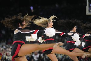 San Diego State cheerleaders perform during the first half of a Final Four college basketball game in the NCAA Tournament on Saturday, April 1, 2023, in Houston.