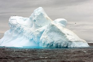 File - View of the melting Collins Glacier in Antarctica, showing the effects of climate change.