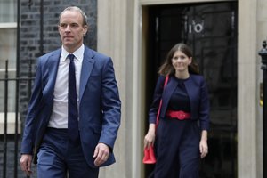 FILE - Dominic Raab, the Deputy Prime Minister, left, leaves 10 Downing Street after a Cabinet meeting the first held by the new British Prime Minister Rishi Sunak in London, Oct. 26, 2022.