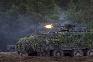 Soldiers take part in the NATO military exercise 'Iron Wolf 2022-II' at a training range in Pabrade, north of the capital Vilnius, Lithuania on Wednesday, Oct. 26, 2022