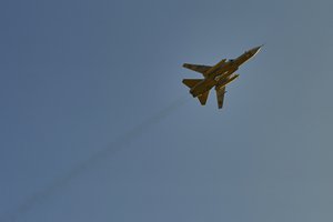 CORRECTS TYPE OF PLANE - A Ukrainian Air Force Sukhoi Su-24 flies over the front line near Bakhmut, Donetsk region, Ukraine, Saturday, Feb. 11, 2023.