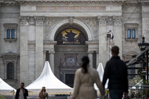 Tourists walk in front of St. Stephen's Basilica in Budapest on Thursday, April 27, 2023 where Pope Francis will meet with bishops, priests and pastoral workers during his visit to Hungary.