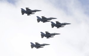 Taiwan's F-16 fighter jets fly in close formation over President Office during National Day celebrations in front of the Presidential Building in Taipei, Taiwan, Oct. 10, 2021