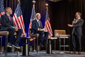 Joe Biden participates in a Q&A with Rep. Hakeem Jeffries (D-NY), left, and Caucus Chair Rep. Pete Aguilar (D-CA) at the Democratic House Caucus Retreat