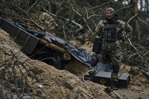 A Ukrainian soldier in a trench close to the Russian positions near Kremenna in the Luhansk region, Ukraine, Tuesday, May 9, 2023