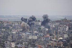 Smoke rises from an explosion caused by an Israeli airstrike, in Gaza Strip, Friday, May 12, 2023