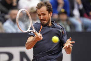 Russia's Daniil Medvedev returns the ball to Germany's Yannick Hanfmann during their quarter final match at the Italian Open tennis tournament, in Rome, Thursday, May 18, 2023.