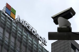 A security surveillance camera is seen near the Microsoft office building in Beijing, July 20, 2021