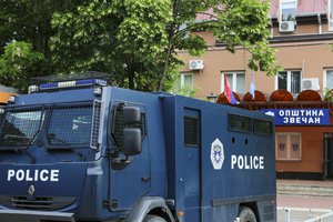 Kosovo police officers guard a municipal building after yesterday's violent clashes between police and ethnic Serbs, in the town of Zvecan, northern Kosovo, Saturday, May 27, 2023.