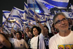 Israelis protest plans by Prime Minister Benjamin Netanyahu's far-right government to overhaul the judicial system, in Tel Aviv, Israel, Saturday, May 27, 2023. (AP Photo/ Ohad Zwigenberg)