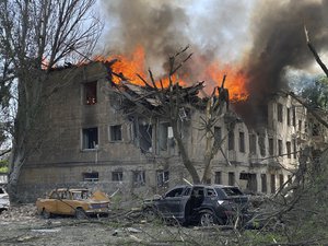 In this handout photo made available by the State Emergency Service of Ukraine, firefighters hose down a Policlinic following a Russian attack in Dnipro, Ukraine, Friday May 26, 2023.