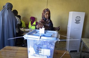 A woman casts her vote in the presidential election in Hargeisa, in the semi-autonomous region of Somaliland, in Somalia Monday, Nov. 13, 2017.