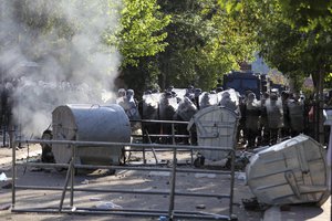 KFOR soldiers guard a municipal building after clashes with Kosovo Serbs in the town of Zvecan, northern Kosovo, Monday, May 29, 2023