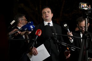 Kosovo's Prime Minister Albin Kurti, center, speaks with the media after the high-level Belgrade-Pristina dialogue meeting at the EEAS building in Brussels, Tuesday, May 2, 2023.