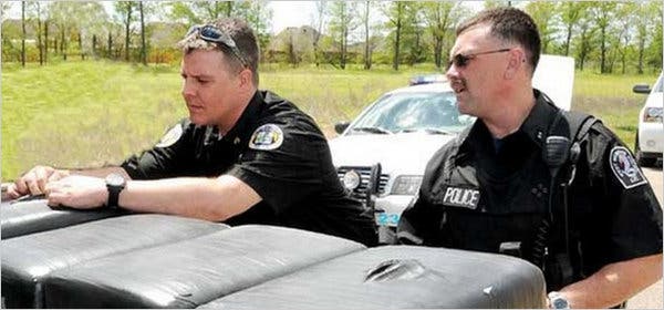 Sgt. Brandon Paudert, left, and Officer Bill Evans were killed in a shootout in West Memphis, Ark.