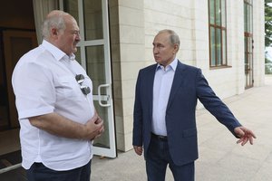 Russian President Vladimir Putin, left, and Belarusian President Alexander Lukashenko speak during their meeting at the Bocharov Ruchei residence in the resort city of Sochi, Russia, Friday, June 9, 2023.