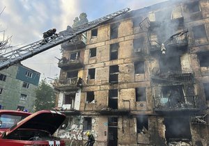 In this photo released by Dnipro Regional Administration, emergency workers extinguish a fire after missiles hit a multi-story apartment building in Kryvyi Rih, Ukraine, Tuesday, June 13, 2023.