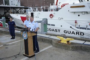 Capt. Jason Neubauer, chief investigator, U.S. Coast, right, speaks with the media as U.S. Coast Guard Rear Adm. John Mauger, commander of the First Coast Guard District, center, looks on during a news conference, Sunday, June 25, 2023, at Coast Guard Base Boston, in Boston