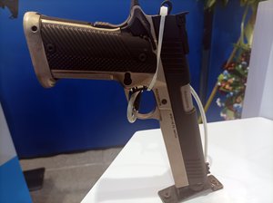 Caliber 45 medallion A2 tactical pistol on display at a Gun Expo event.