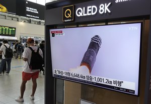 A TV screen shows an image of North Korea's missile launch during a news program, at the Seoul Railway Station in Seoul, South Korea, Thursday, July 13, 2023