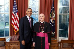 President Barack Obama receives credentials from Apostolic Nuncio Carlo Maria Vigano of the Holy See, in the Oval Office