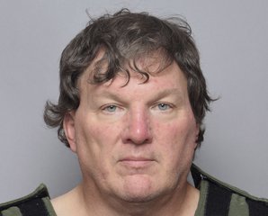 This booking image provided by Suffolk County Sheriff’s Office, shows Rex Heuermann