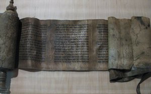 A 13th/14th-century scroll of the Book of Esther from Fez, Morocco, held at the Musée du quai Branly in Paris. Traditionally, a scroll of Esther is given only one roller, fixed to its lefthand side, rather than the two used for a Torah scroll