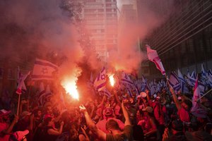 Israelis protest against plans by Prime Minister Benjamin Netanyahu's government to overhaul the judicial system in Tel Aviv, Israel, Tuesday, July 18, 2023