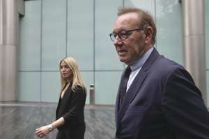 Actor Kevin Spacey, right, arrives at the Southwark Crown Court after lunch break in London, Britain, Friday, July 14, 2023