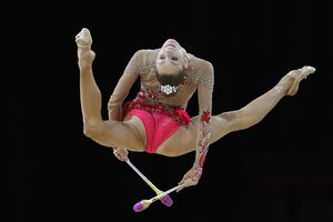 Carmel Kallemaa of Canada performs with the clubs in the Apparatus final of the Rhythmic Gymnastics competition at the Commonwealth Games in Birmingham, England, Saturday, Aug. 6, 2022