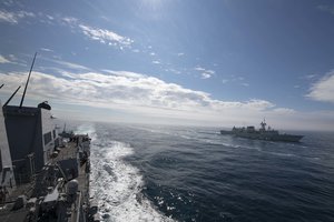 SEA OF LABRADOR (Aug. 9, 2020) The Arleigh Burke-class guided-missile destroyer USS Thomas Hudner (DDG 116) and the Royal Canadian Navy ship HMCS Ville de Quebec (FFH 332), approach the Royal Canadian Ship MV Asterix during a replenishment-at-sea, Aug. 9, 2020.