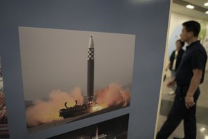 A photo showing North Korea's missile launch is displayed at the Unification Observation Post in Paju, South Korea, near the border with North Korea, Wednesday, July 19, 2023