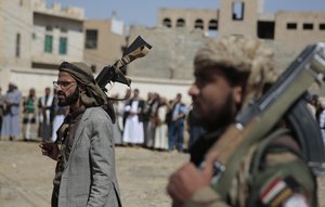 File - Armed Houthi fighters attend the funeral procession of Houthi rebel fighters who were killed in recent fighting with forces of Yemen's internationally recognized government, in Sanaa, Yemen, Wednesday, Nov. 24, 2021.