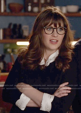 Jess's black dress with white eyelet collar and cuffs on New Girl