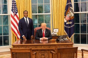 President Donald Trump in September 2018 with 2018 Michigan senatorial candidate John E. James in the Oval Office.