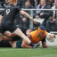 Tom Hooper scores for the Wallabies against New Zealand.