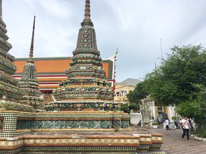 Multiple chedis located near temple grounds exit. Taken in Bangkok, Thailand on August 2018.