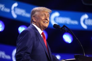 Donald Trump speaking with attendees at the 2023 Turning Point Action Conference in West Palm Beach, Florida