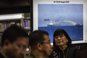 Footage of a Chinese Coast Guard ship using a water cannon against a Filipino resupply vessel is shown during a press conference at the Philippine Department of Foreign Affairs in Manila, Philippines on Monday, Aug. 7, 2023