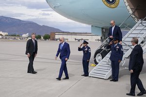 President Joe Bidensteps off Air Force One upon arrival at Kirtland Air Force Base, Tuesday, Aug. 8, 2023, in Albuquerque