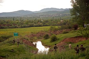 Georgian police at the barbed wire fences installed by the Russian and South Ossetian forces at Khurvaleti in 2016