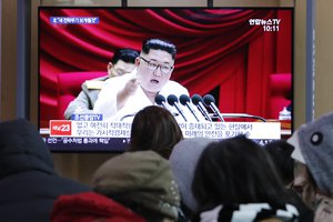 People watch a TV screen showing a file image of North Korean leader Kim Jong Un during a news program n Seoul, South Korea