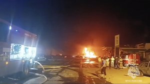 Fire is seen next to a petrol station on a road near Makhachkala, the capital of Dagestan, Russia