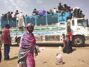 FILE - People board a truck as they leave Khartoum, Sudan, on June 19, 2023. Clashes resumed between Sudan's military and a powerful paramilitary force after a three-day cease-fire expired Wednesday morning, June 21, 2023, a protest group and residents reported.