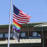 The US flag, the rainbow pride flag and a Black Lives Matter flag fly over the Nativity School of Worcester, Massachusetts.