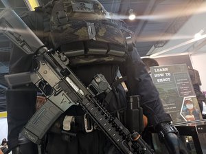 Combat gear on display at a Gun Expo event.